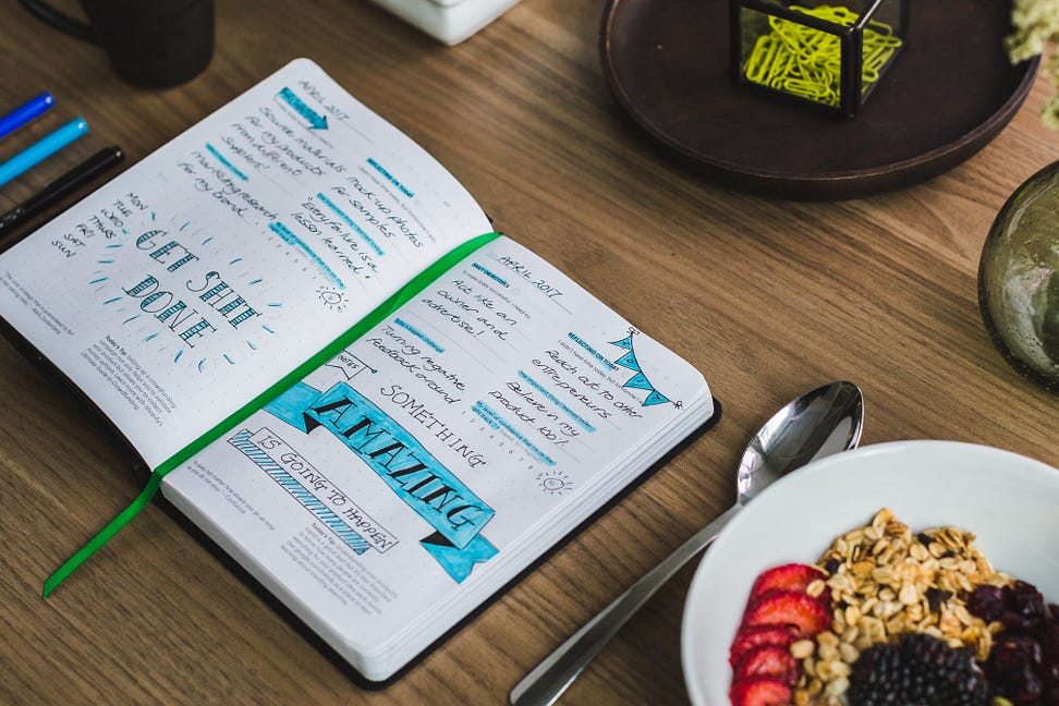 An Entrepreneurs planner (bullet journal) filled with notes and appointments, most of which are assignable to a virtual assistant.
