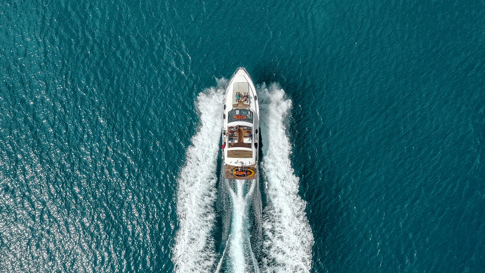 Luxury Yacht chartered to travel across the open water. A way of travel for the wealthy.